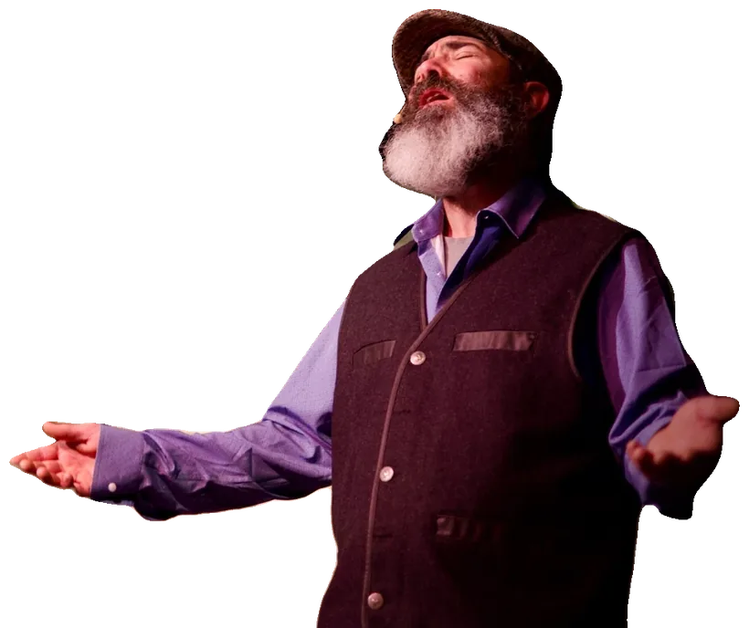 Tevye spreads his arms wide in welcome, his face turned upward in song.